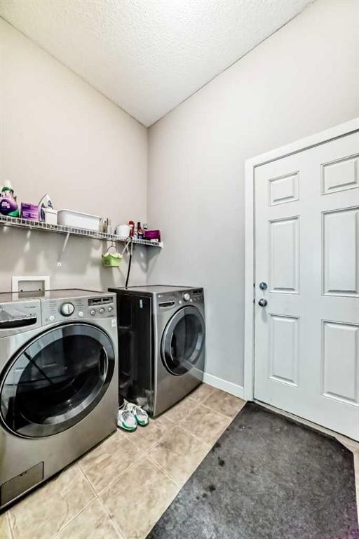 198 Brightonstone Bay Se, Calgary, AB - Indoor Photo Showing Laundry Room