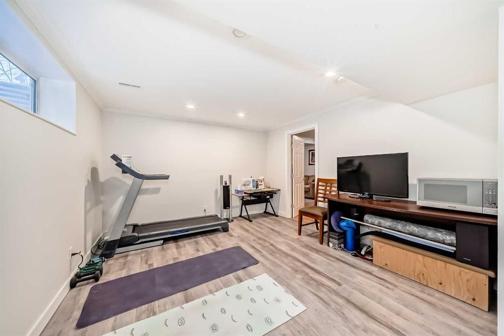 198 Brightonstone Bay Se, Calgary, AB - Indoor Photo Showing Gym Room
