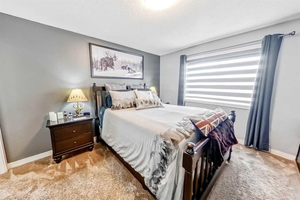 562 New Brighton Drive Se, Calgary, AB - Indoor Photo Showing Bedroom