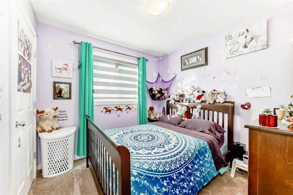 562 New Brighton Drive Se, Calgary, AB - Indoor Photo Showing Bedroom