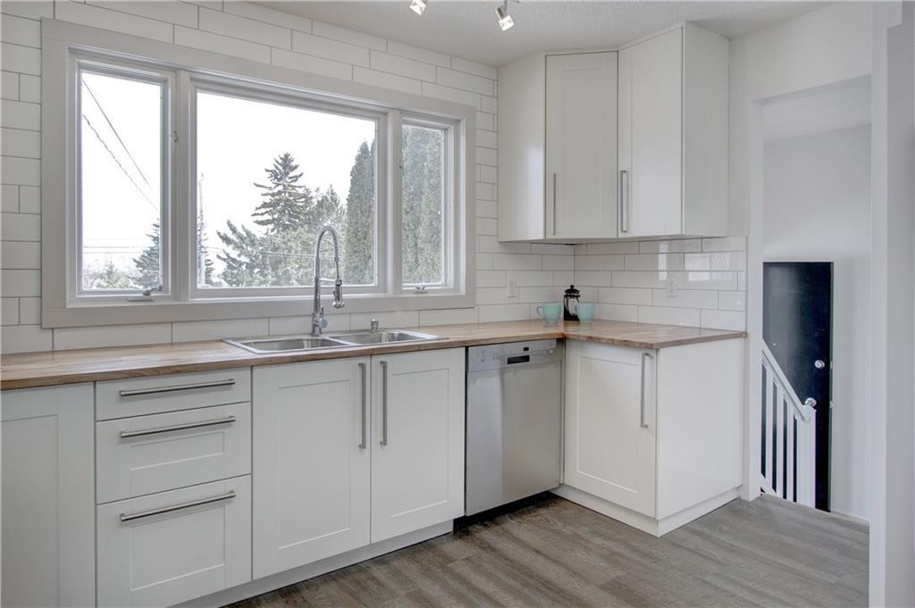 10212 7 Street Sw, Calgary, AB - Indoor Photo Showing Kitchen With Double Sink