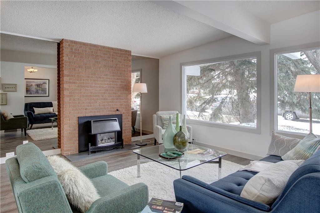 10212 7 Street Sw, Calgary, AB - Indoor Photo Showing Living Room With Fireplace