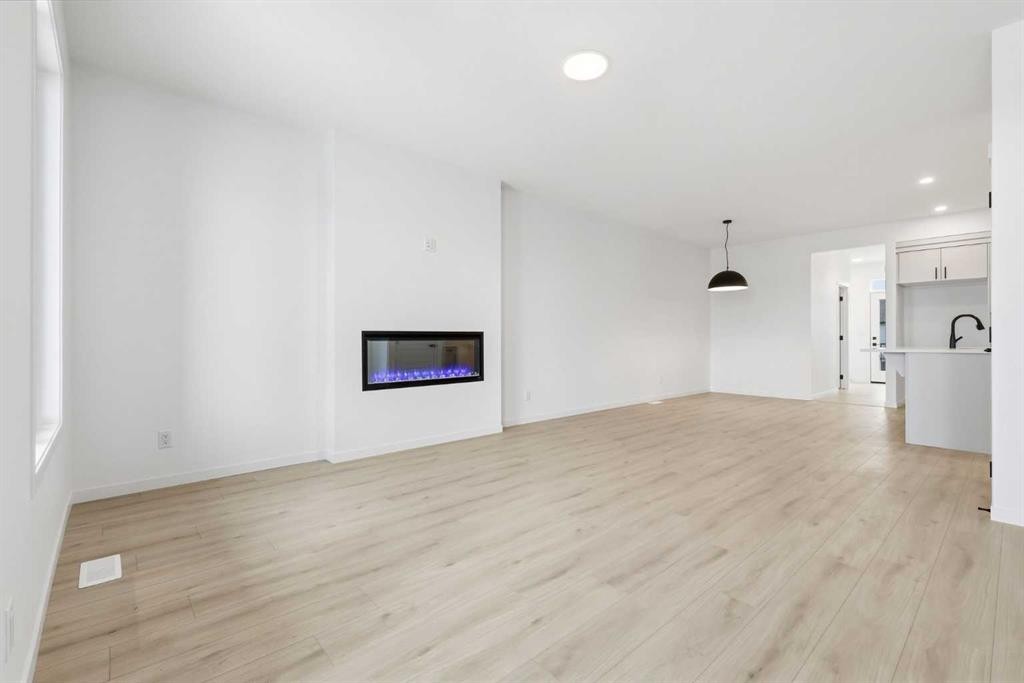 355 Herron Landing Ne, Calgary, AB - Indoor With Fireplace