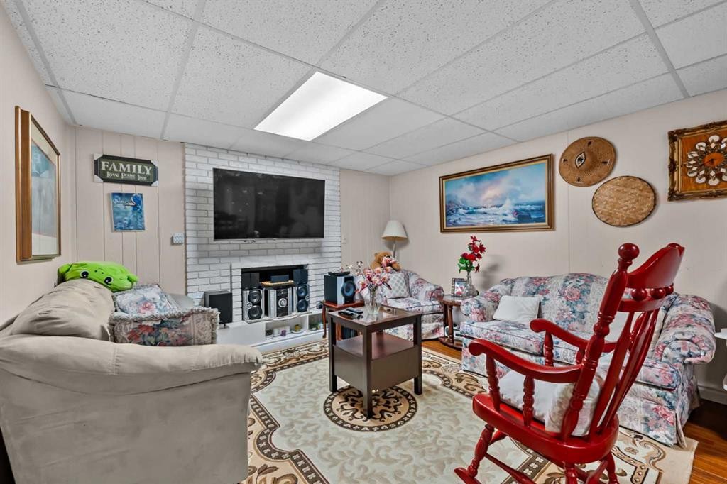 2220 38 Street Sw, Calgary, AB - Indoor Photo Showing Living Room With Fireplace