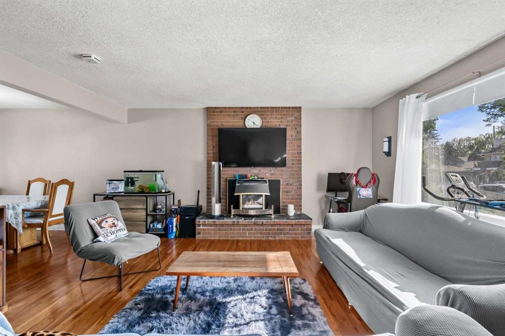 2220 38 Street Sw, Calgary, AB - Indoor Photo Showing Living Room With Fireplace