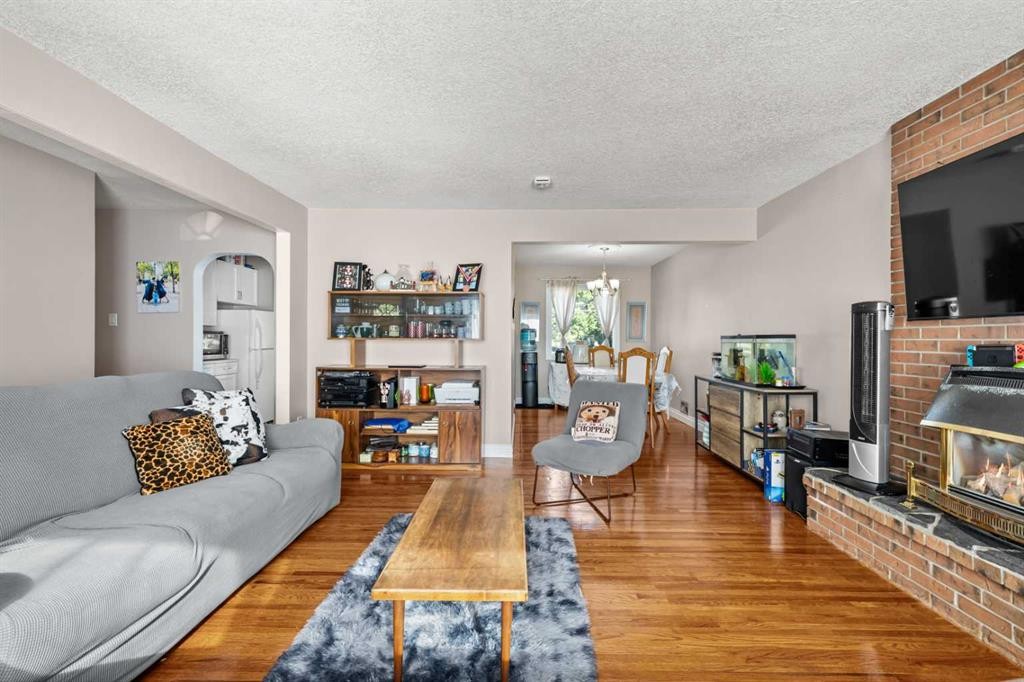 2220 38 Street Sw, Calgary, AB - Indoor Photo Showing Living Room With Fireplace