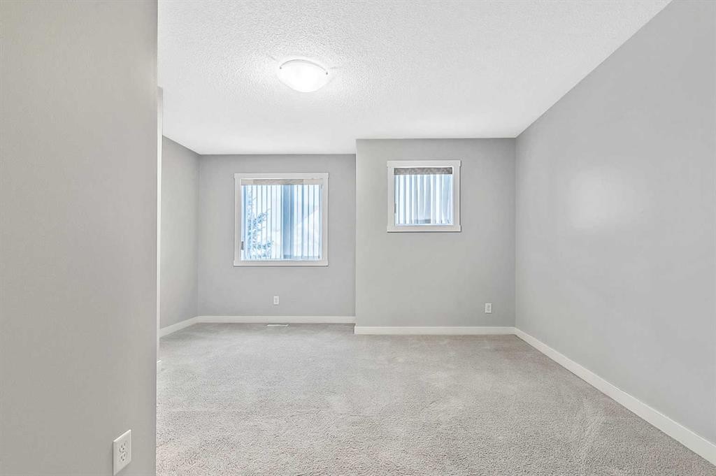 1305-2445 Kingsland Road Se, Airdrie, AB - Indoor Photo Showing Other Room
