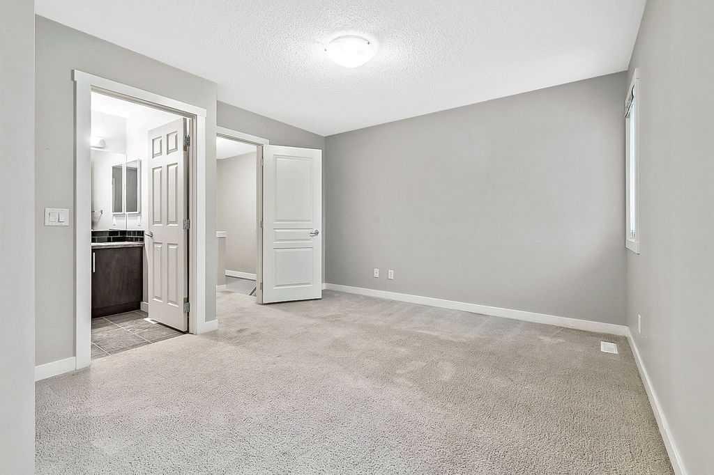 1305-2445 Kingsland Road Se, Airdrie, AB - Indoor Photo Showing Other Room
