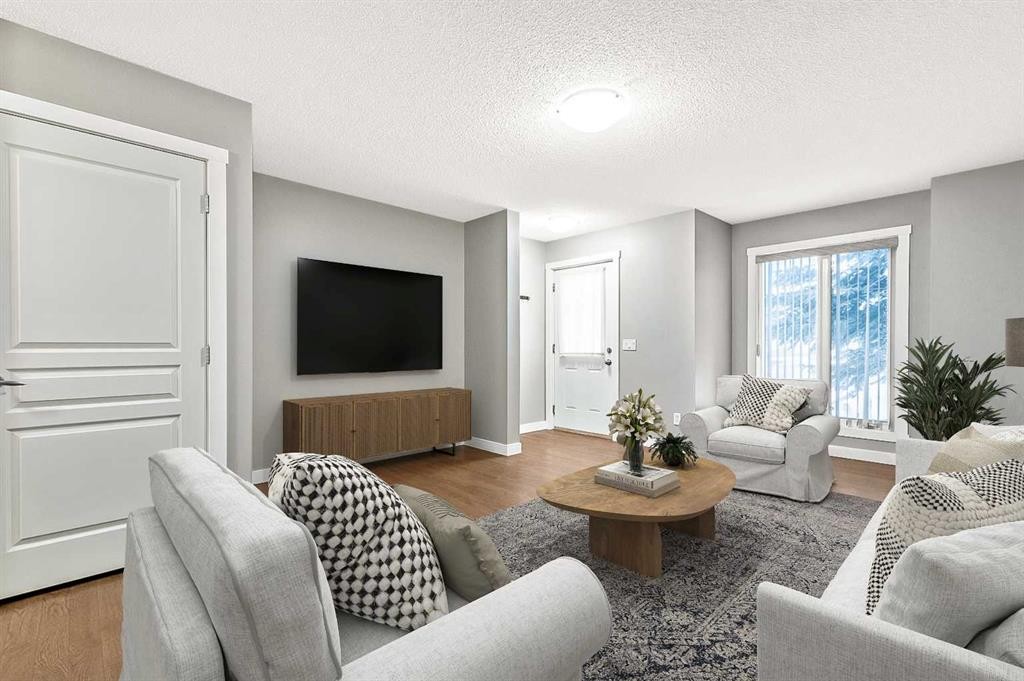 1305-2445 Kingsland Road Se, Airdrie, AB - Indoor Photo Showing Living Room