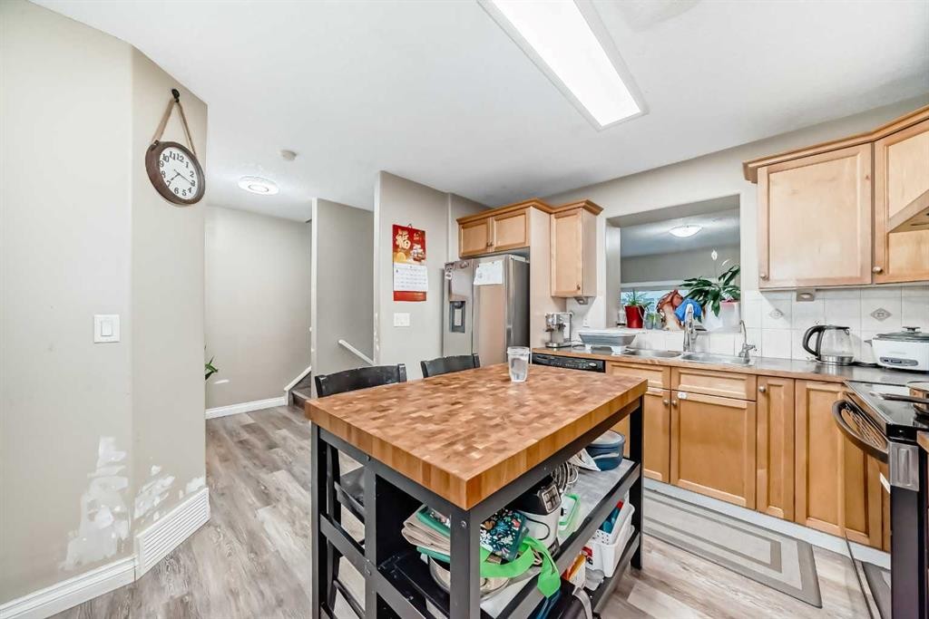 14 Dover Mews Se, Calgary, AB - Indoor Photo Showing Kitchen With Double Sink