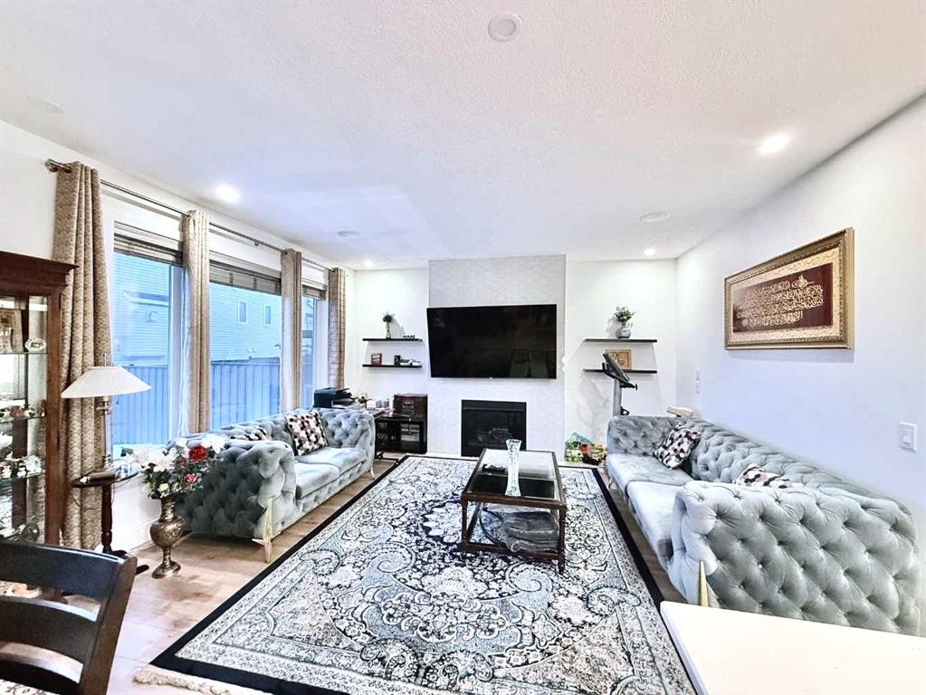 148 Carrington Circle Nw, Calgary, AB - Indoor Photo Showing Living Room With Fireplace