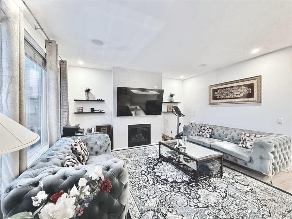 148 Carrington Circle Nw, Calgary, AB - Indoor Photo Showing Living Room With Fireplace