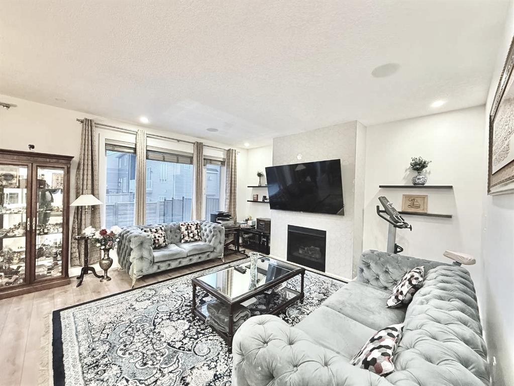 148 Carrington Circle Nw, Calgary, AB - Indoor Photo Showing Living Room With Fireplace