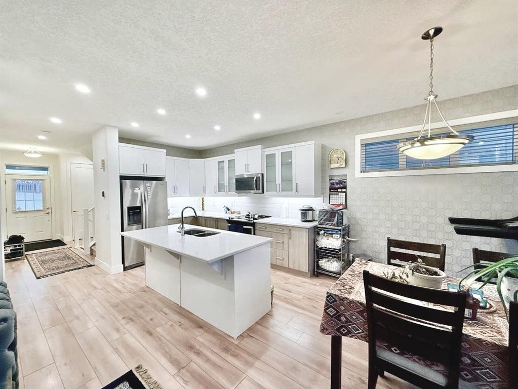 148 Carrington Circle Nw, Calgary, AB - Indoor Photo Showing Kitchen With Stainless Steel Kitchen With Upgraded Kitchen