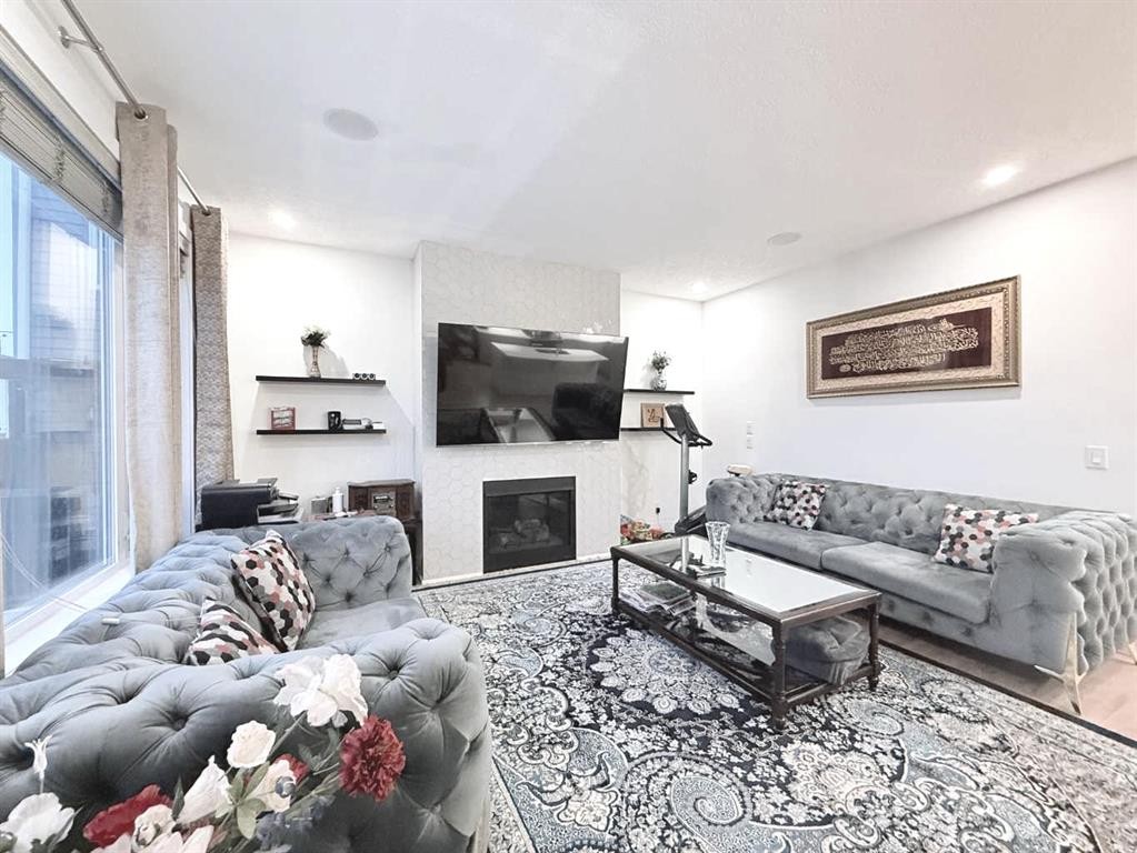 148 Carrington Circle Nw, Calgary, AB - Indoor Photo Showing Living Room With Fireplace