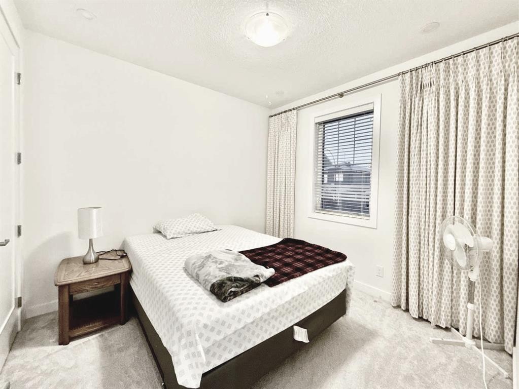 148 Carrington Circle Nw, Calgary, AB - Indoor Photo Showing Bedroom