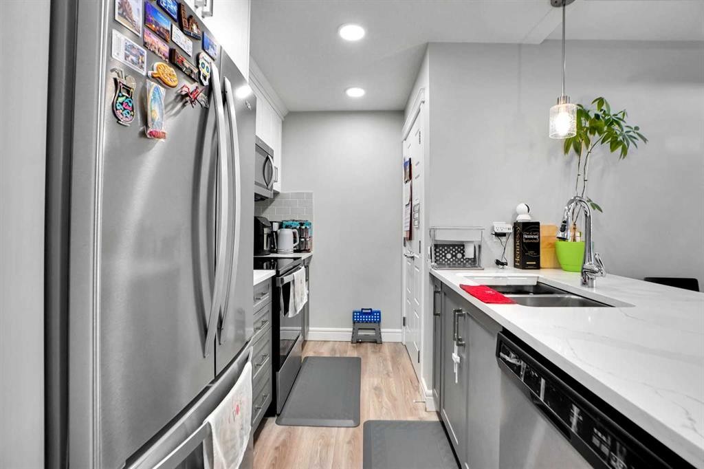 28 Savanna Passage Ne, Calgary, AB - Indoor Photo Showing Kitchen With Stainless Steel Kitchen With Double Sink