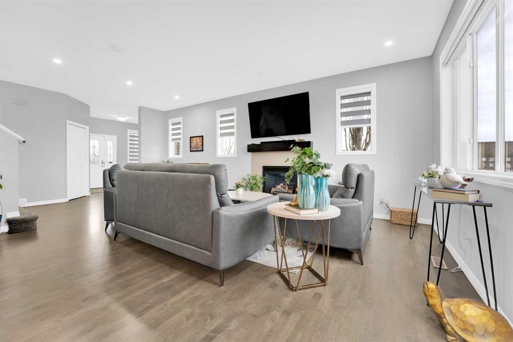 2101 Luxstone Boulevard Sw, Airdrie, AB - Indoor Photo Showing Living Room With Fireplace