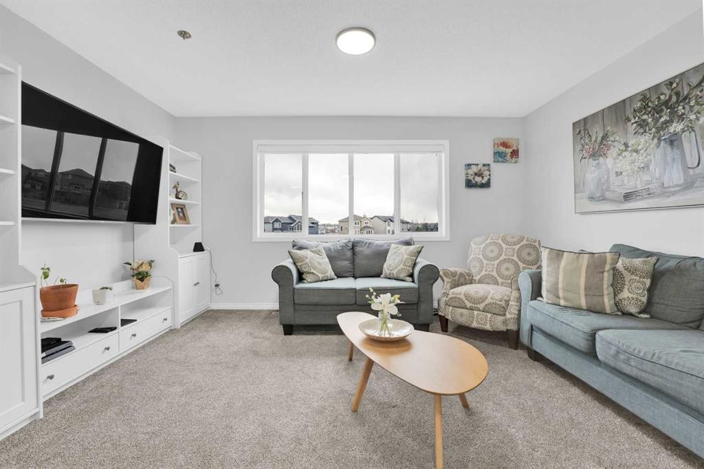 2101 Luxstone Boulevard Sw, Airdrie, AB - Indoor Photo Showing Living Room