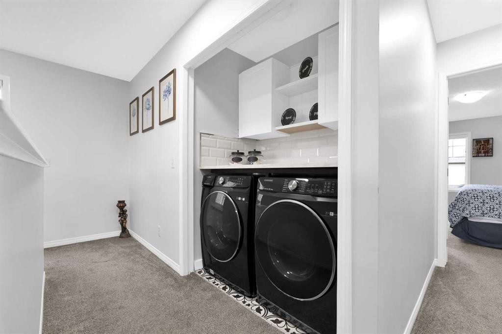 2101 Luxstone Boulevard Sw, Airdrie, AB - Indoor Photo Showing Laundry Room