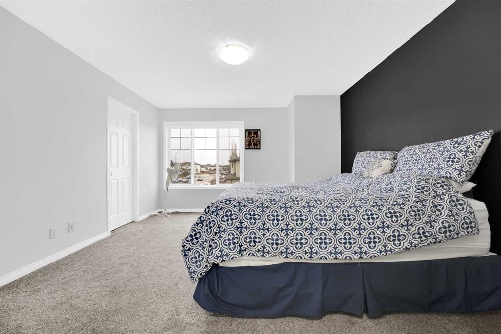 2101 Luxstone Boulevard Sw, Airdrie, AB - Indoor Photo Showing Bedroom