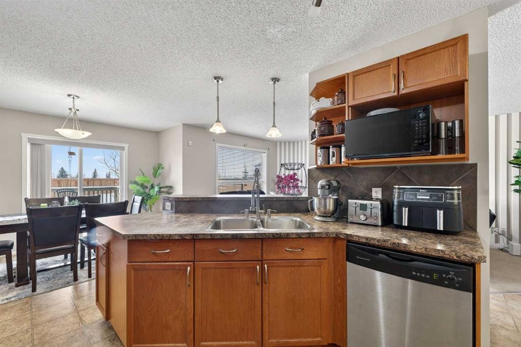 106 Saddlecrest Crescent Ne, Calgary, AB - Indoor Photo Showing Kitchen With Double Sink