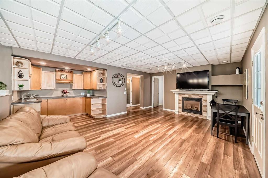 52 Hidden Vale Crescent Nw, Calgary, AB - Indoor Photo Showing Other Room With Fireplace