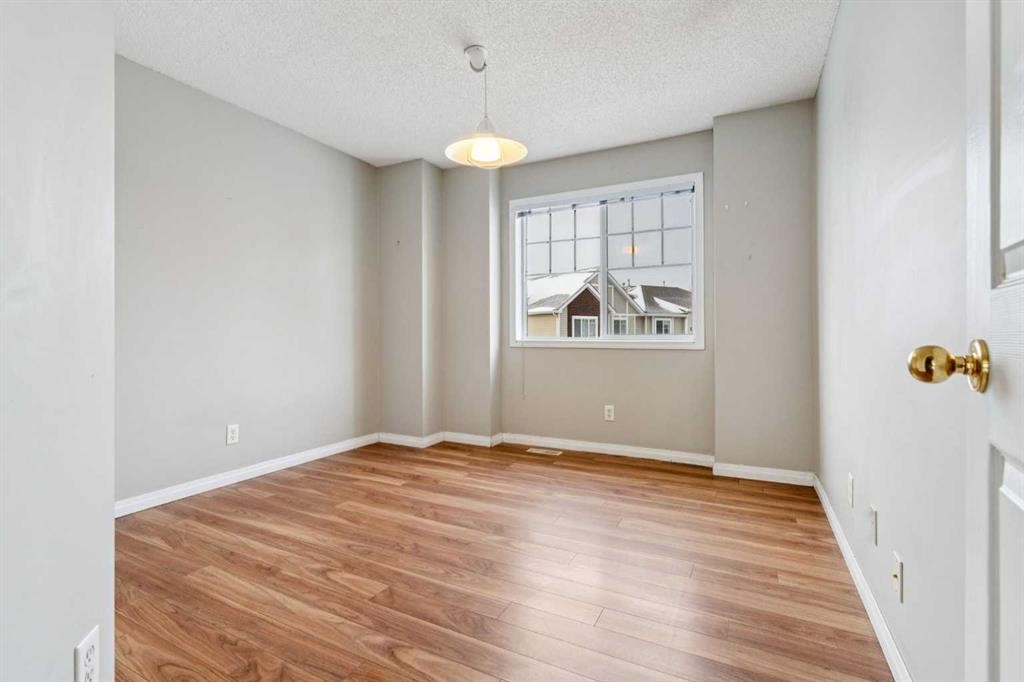 157 Hidden Creek Gardens Nw, Calgary, AB - Indoor Photo Showing Other Room With Fireplace