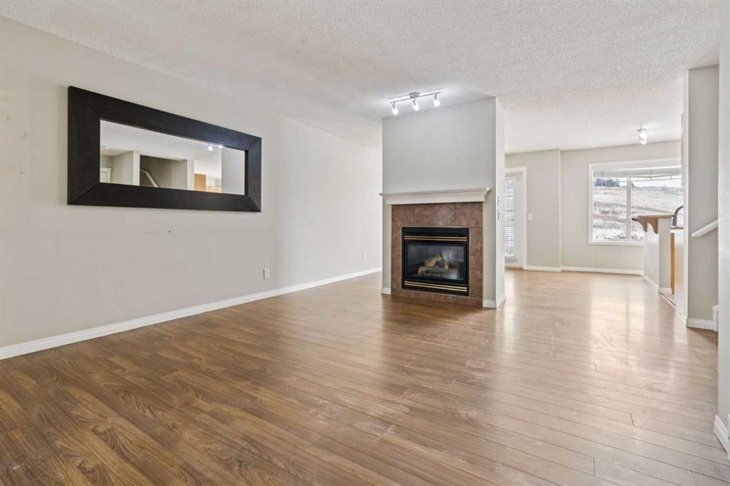 157 Hidden Creek Gardens Nw, Calgary, AB - Indoor Photo Showing Living Room With Fireplace