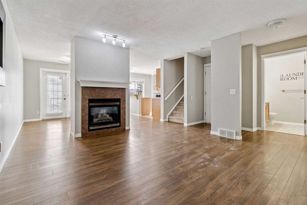 157 Hidden Creek Gardens Nw, Calgary, AB - Indoor Photo Showing Living Room With Fireplace