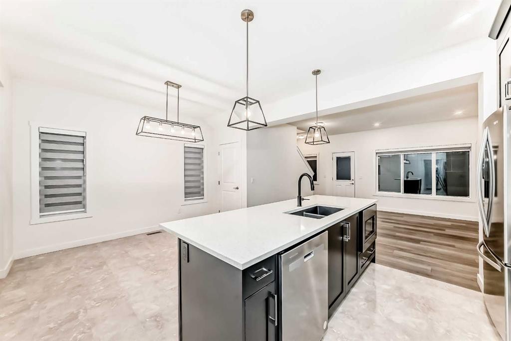 1449 Bayview Point Sw, Airdrie, AB - Indoor Photo Showing Kitchen With Double Sink