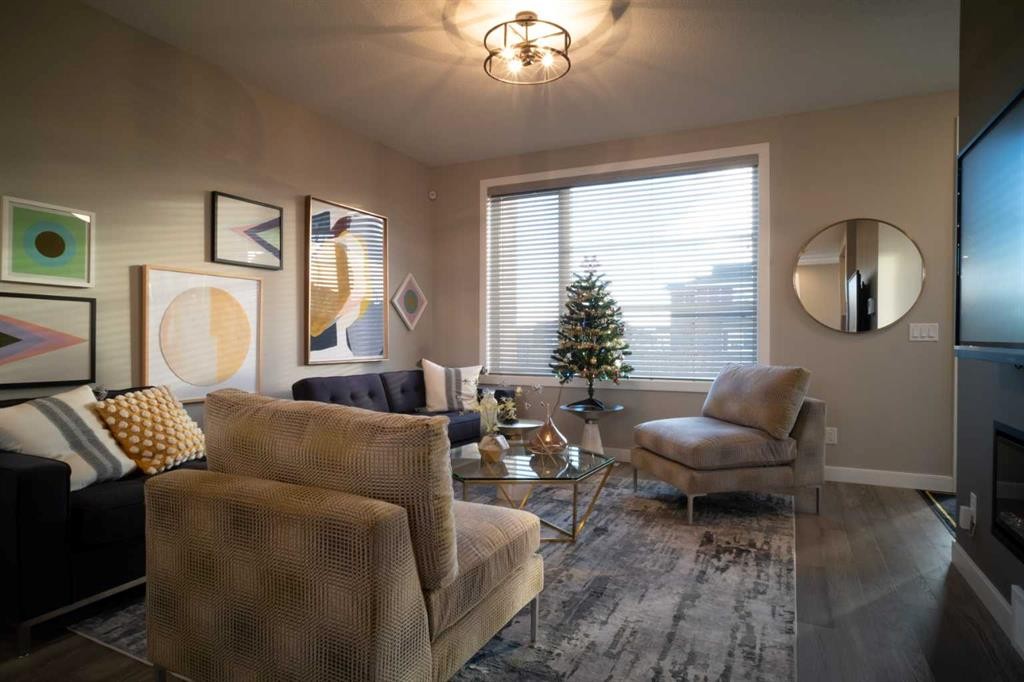 237 Cobblestone Gate Sw, Airdrie, AB - Indoor Photo Showing Living Room With Fireplace