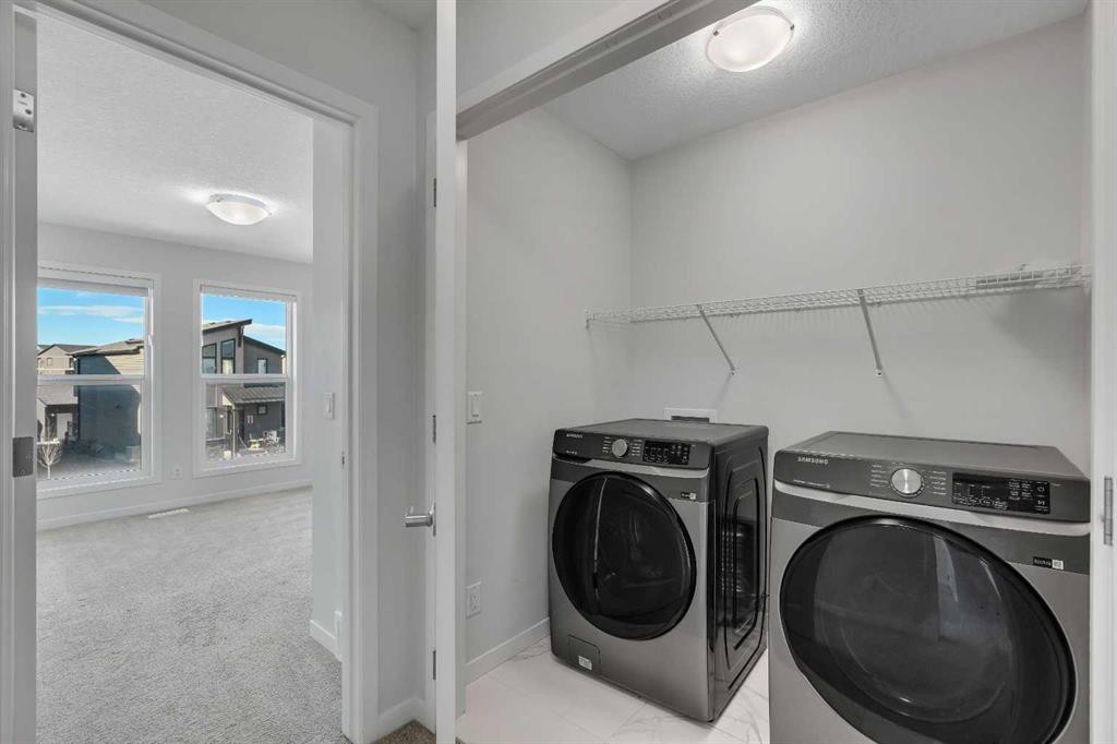 20 Rowley Common Nw, Calgary, AB - Indoor Photo Showing Laundry Room