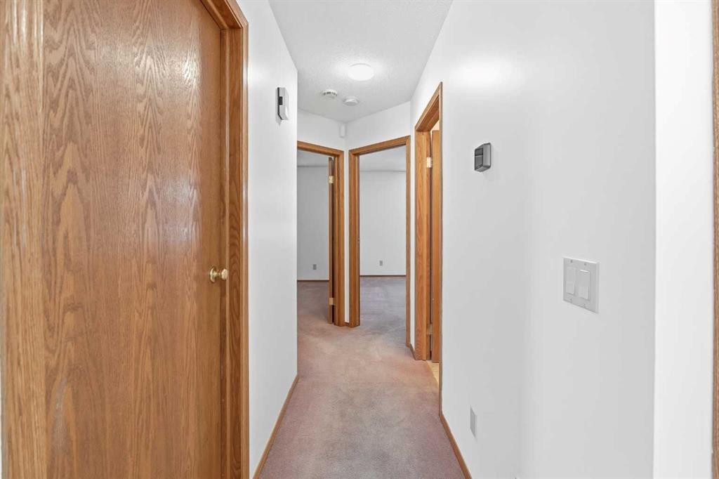 12 Arbour Cliff Close Nw, Calgary, AB - Indoor Photo Showing Other Room