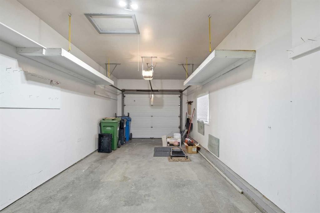 12 Arbour Cliff Close Nw, Calgary, AB - Indoor Photo Showing Garage