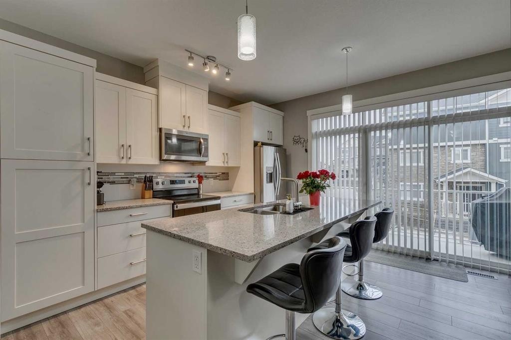 659 Evanston Manor Nw, Calgary, AB - Indoor Photo Showing Kitchen With Double Sink