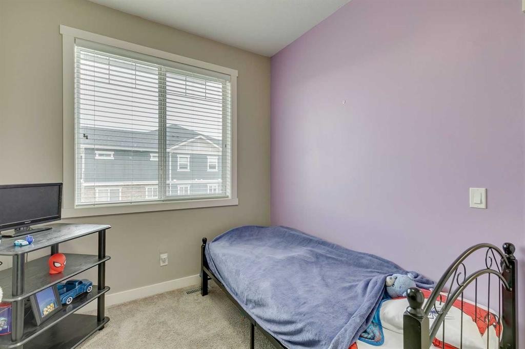 659 Evanston Manor Nw, Calgary, AB - Indoor Photo Showing Bedroom