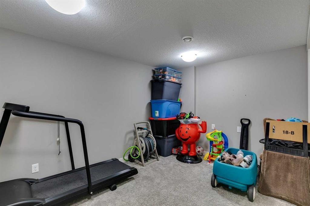 659 Evanston Manor Nw, Calgary, AB - Indoor Photo Showing Gym Room