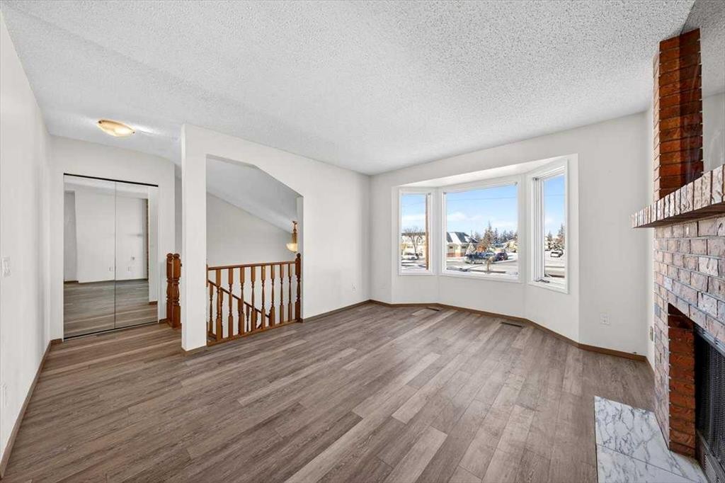 184 Falmere Way Ne, Calgary, AB - Indoor With Fireplace