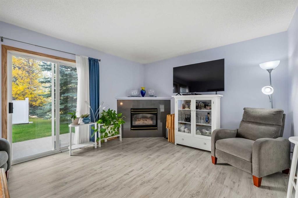 147 Somervale Park Sw, Calgary, AB - Indoor Photo Showing Living Room With Fireplace