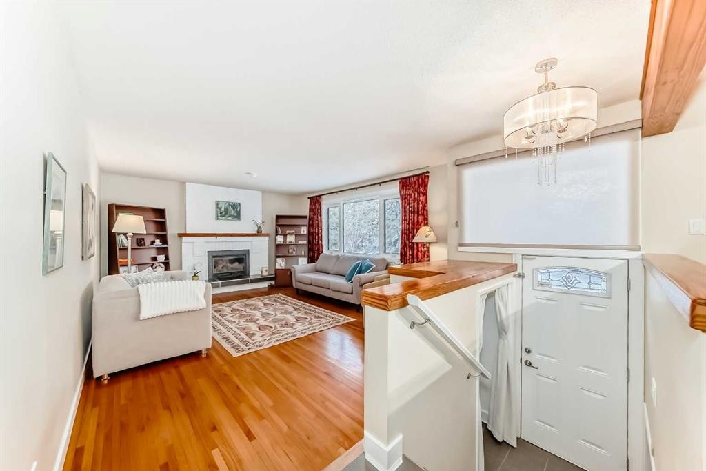 4803 Montana Drive Nw, Calgary, AB - Indoor Photo Showing Living Room With Fireplace
