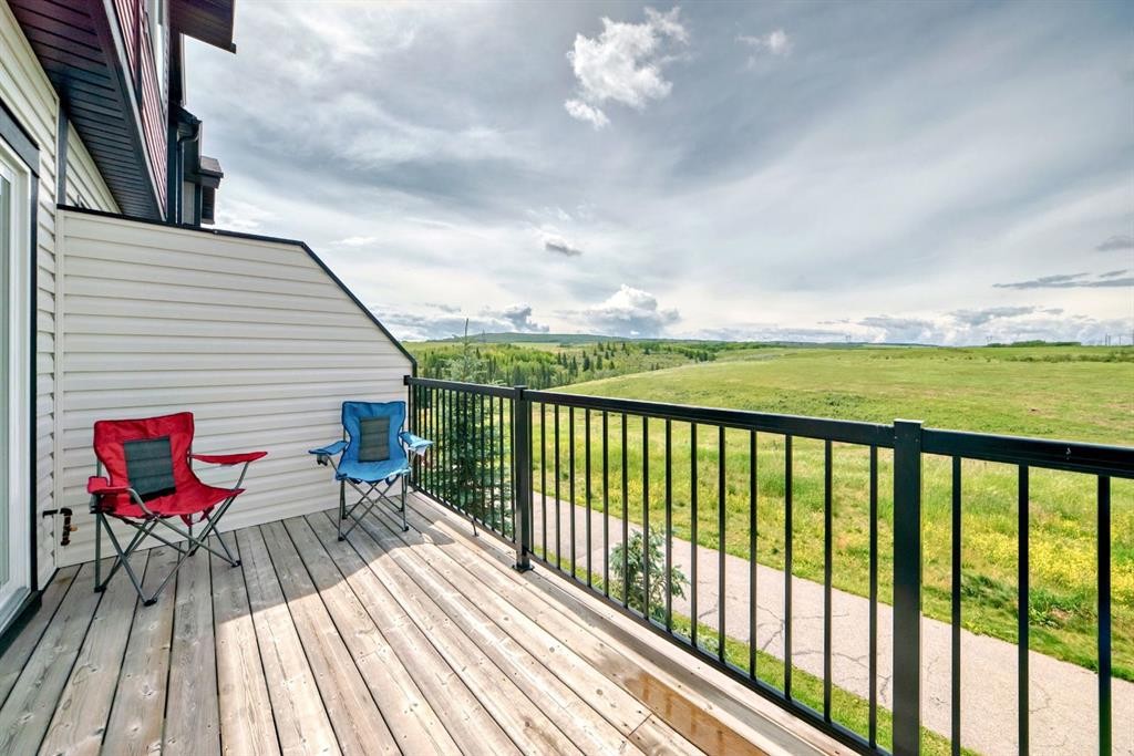 1703 Jumping Pound Common, Cochrane, AB - Outdoor With Deck Patio Veranda With Exterior