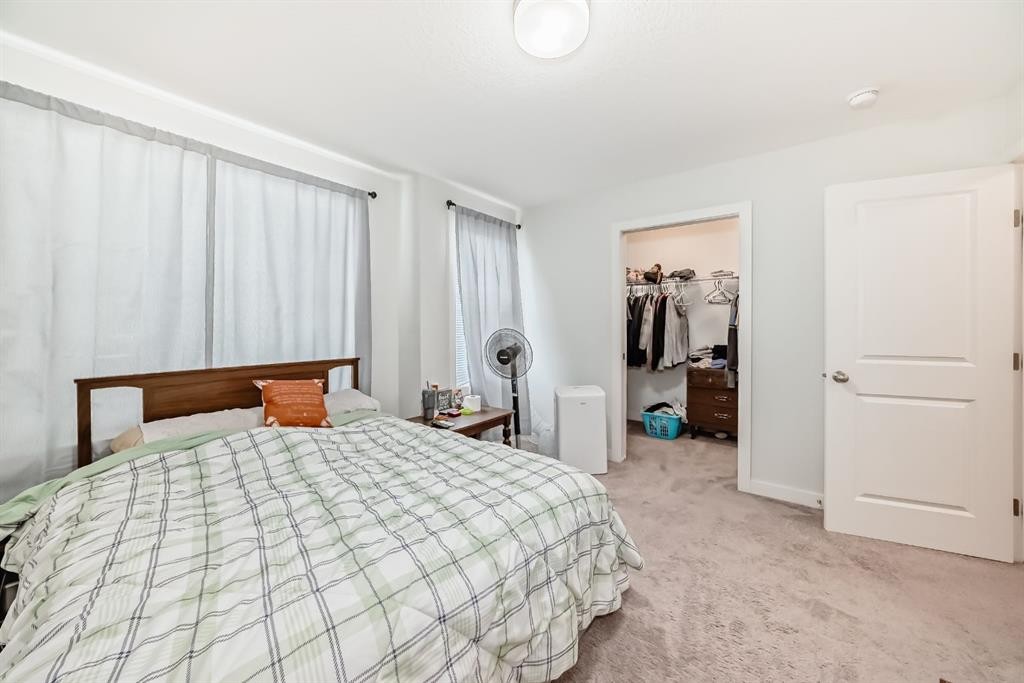 1703 Jumping Pound Common, Cochrane, AB - Indoor Photo Showing Bedroom