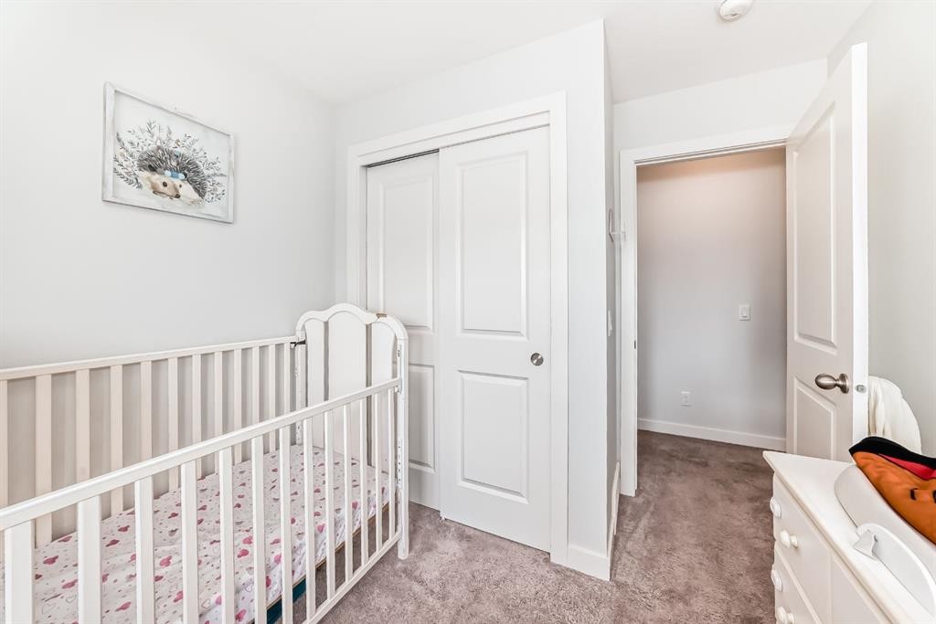 1703 Jumping Pound Common, Cochrane, AB - Indoor Photo Showing Bedroom