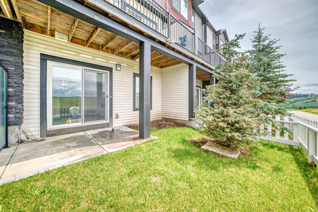 1703 Jumping Pound Common, Cochrane, AB - Outdoor With Deck Patio Veranda With Exterior