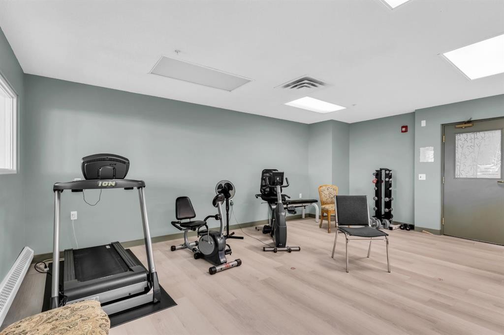 314-4500 50 Avenue, Olds, AB - Indoor Photo Showing Gym Room