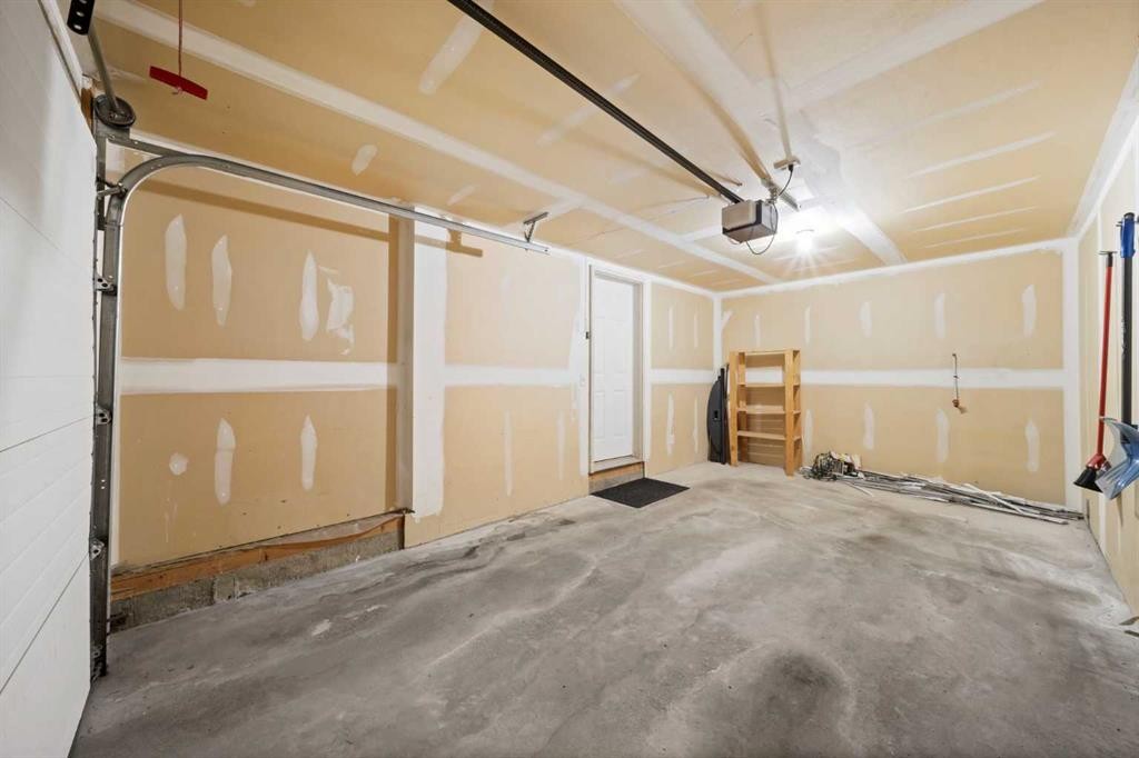 213 Copperfield Lane Se, Calgary, AB - Indoor Photo Showing Garage