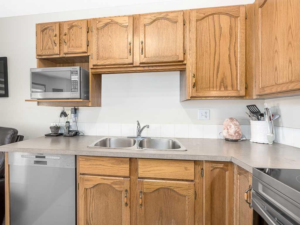 119 Mt Douglas Manor Se, Calgary, AB - Indoor Photo Showing Kitchen With Double Sink