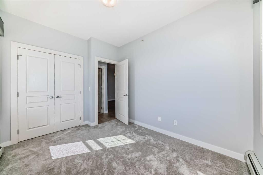 417-2300 Evanston Square Nw, Calgary, AB - Indoor Photo Showing Other Room