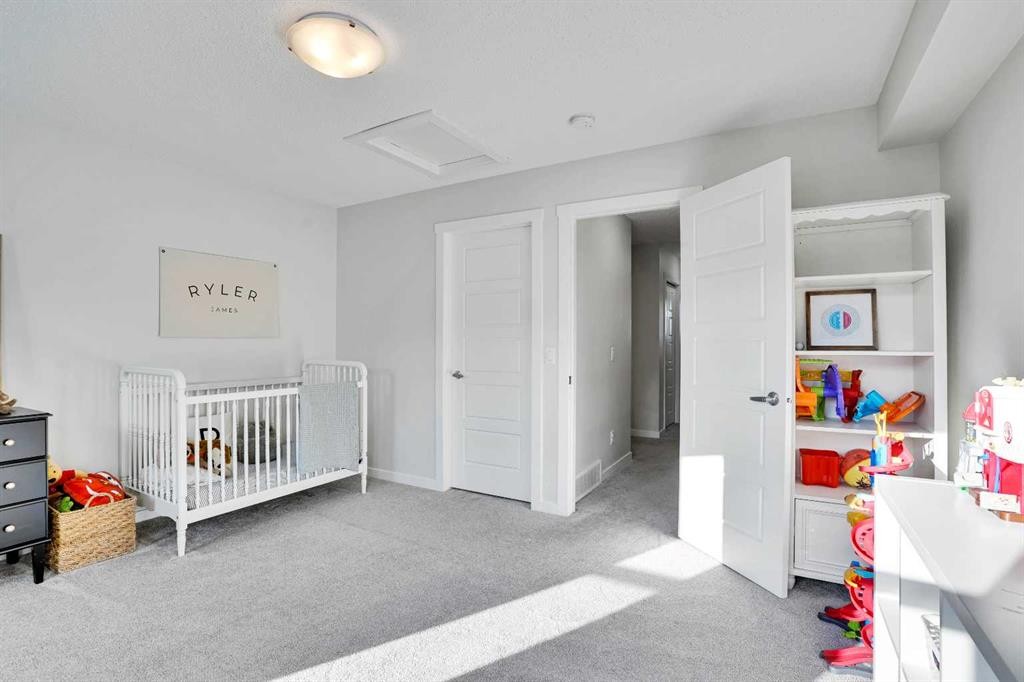 128 Cranbrook Square Se, Calgary, AB - Indoor Photo Showing Bedroom